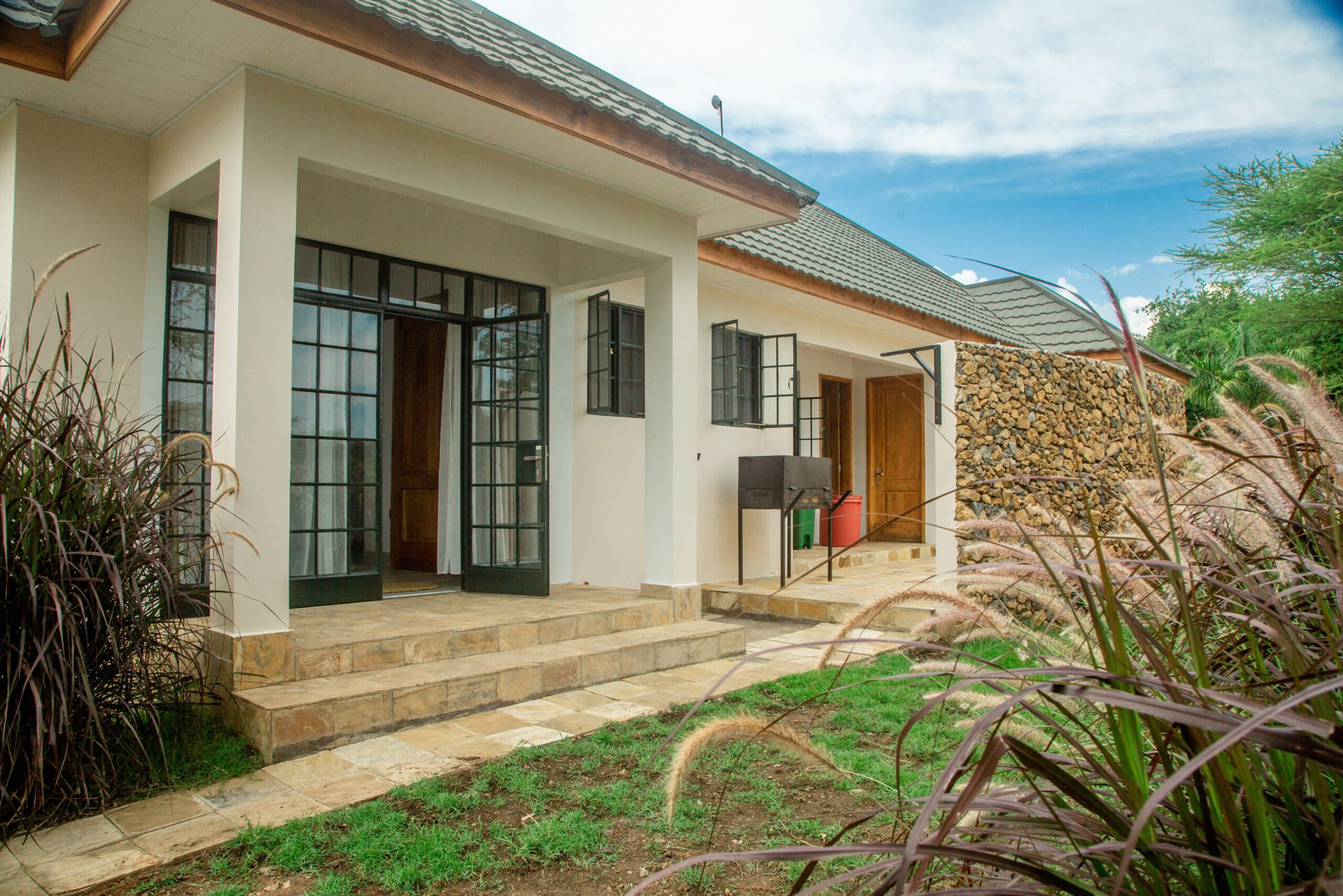 Entrance steps and glass doors of the cottage