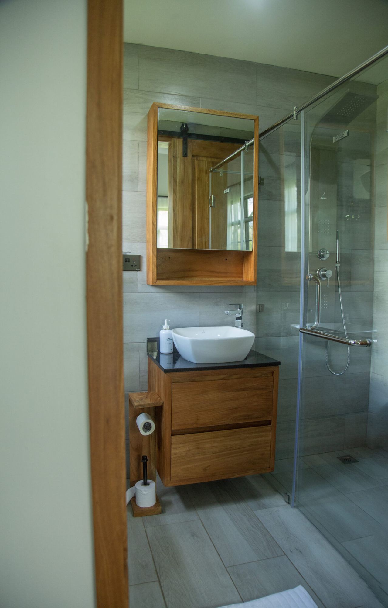 Bathroom with walk-in shower and timber vanity