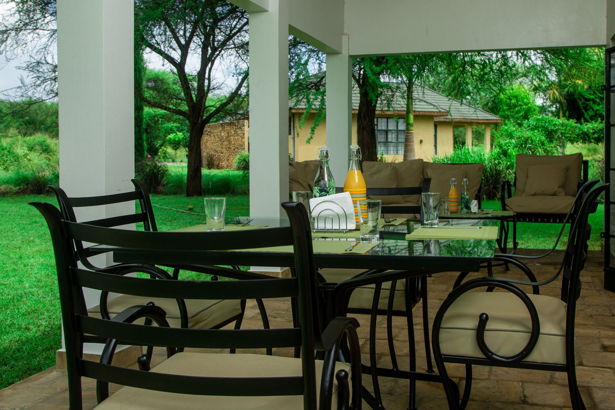 Covered veranda with a table looking out over the lawn